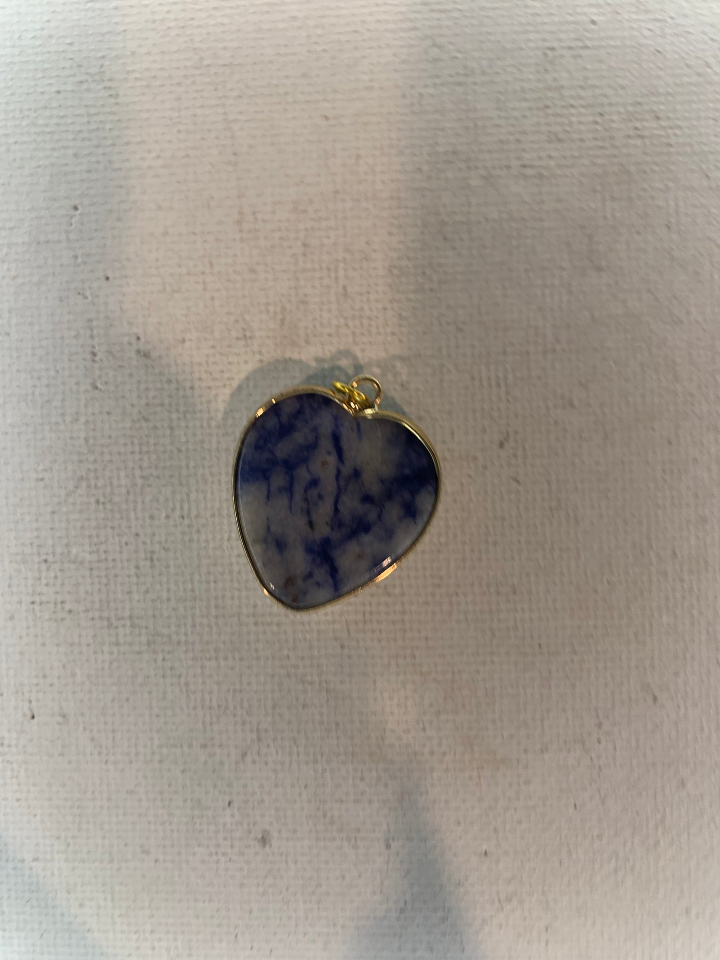 Sodalite pendant in gold.