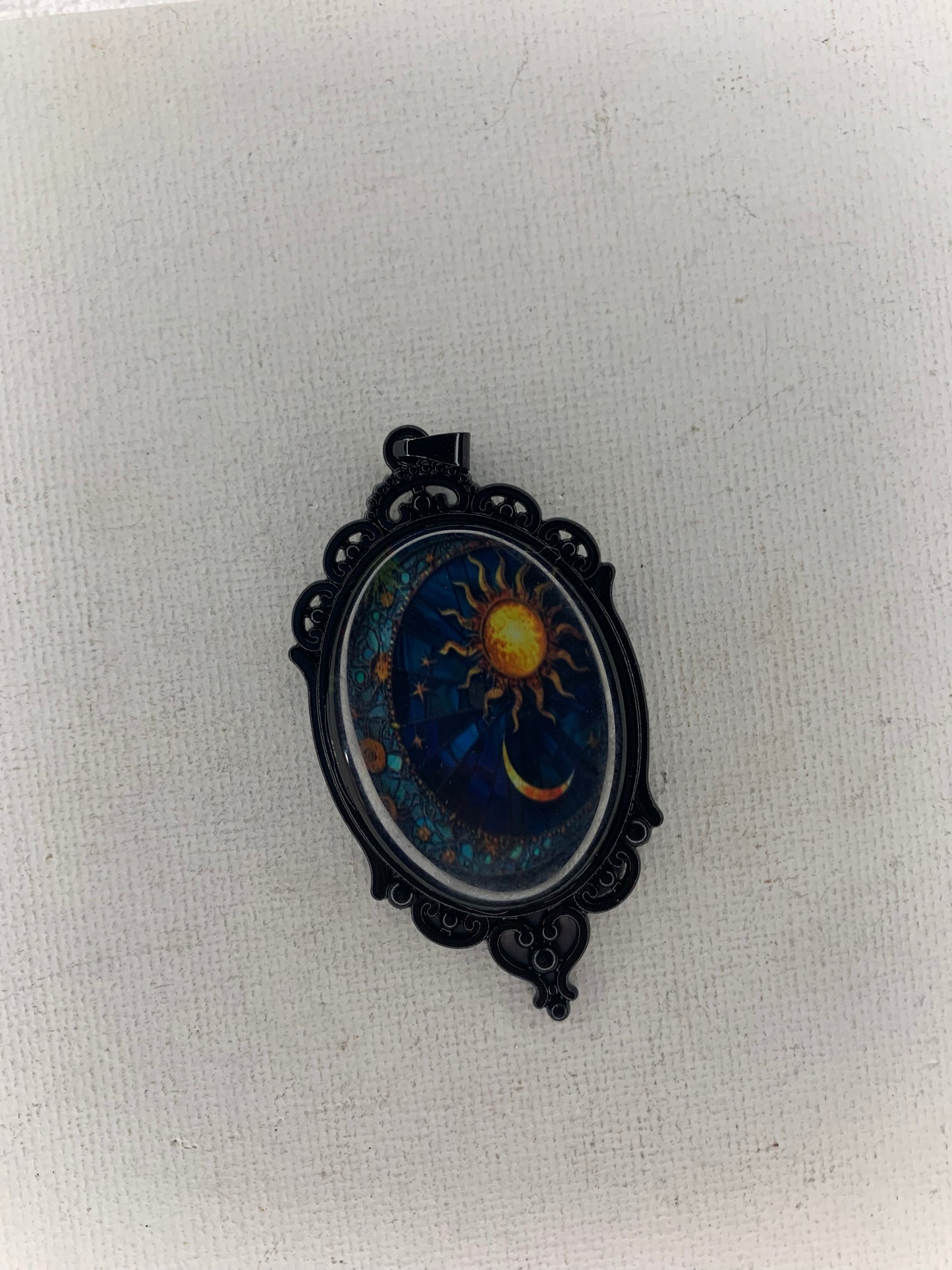 Sun and moon pendant