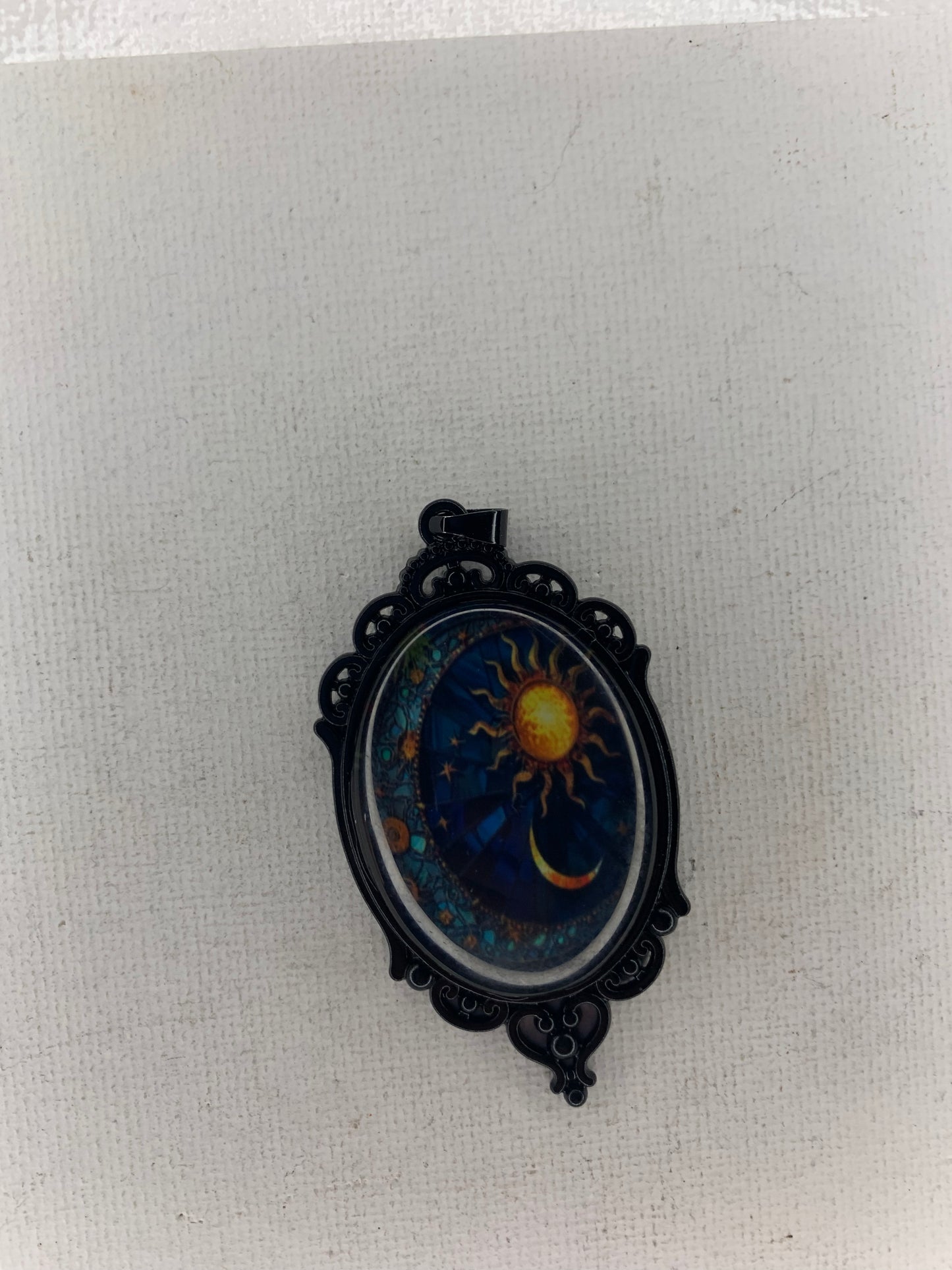 Sun and moon pendant