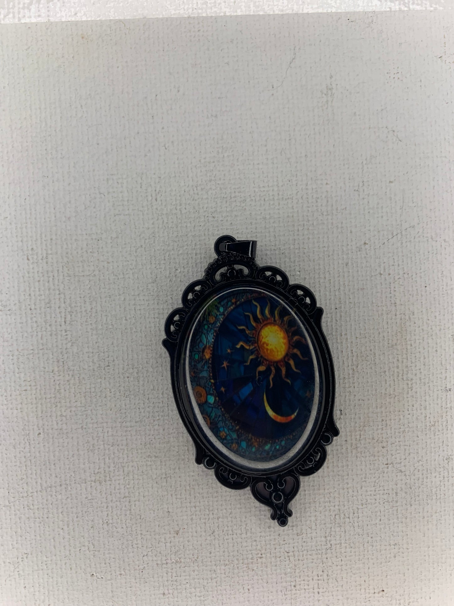 Sun and moon pendant