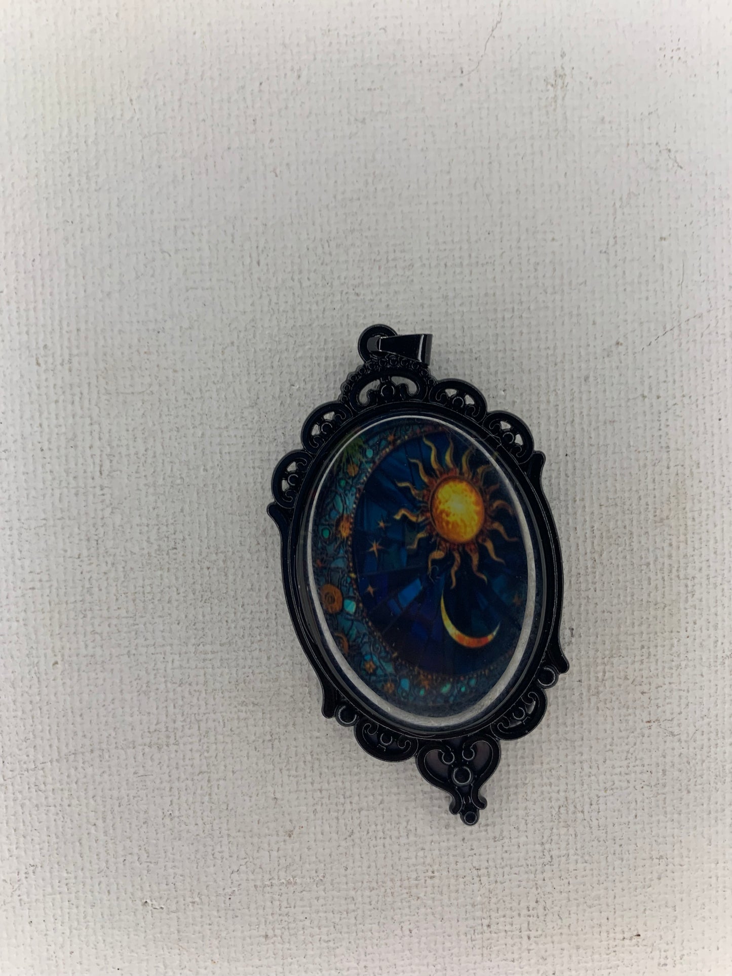 Sun and moon pendant